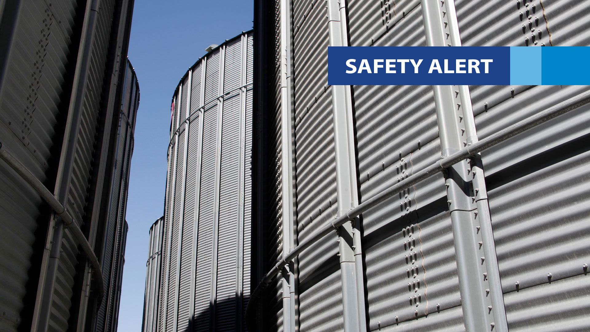 Closeup of a group of steel grain silos